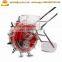 Hands pushing seeder manual bean seeder machine peanut planter