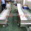 Material handling bucket conveyor with side guard and flight