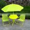 Green color kids table and chair set in garden