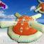 Green and white floating inflatable water park with volleyball court