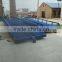 Logistic equipment container unloading system