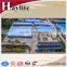Livestock hay feeder for cattle and horse corral feeder with roof