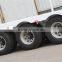 Tri-axle 40-60 ton Low Flatbed Semi Trailer Low Bed Excavator Truck Trailer Trucks And Trailers