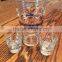 Stylish glass cocktail shaker with 2 shot glass