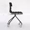 Black plastic stackable wheel chair for studio