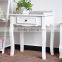 four leged small white portable wood table