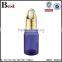 wholesale hot selling 30ml golden aluminum basket dropper essential oil perfume empty blue glass bottle dropper manufacturer