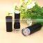 Empty matte black plastic lipstick container with clear base