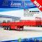 Tri-axis 40ft flat bed cargo transporting side breast board trailer truck with container locks