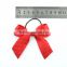 Selling red satin ribbon bow with silver elastic loop