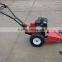 Two wheel tractor with sickle bar mower