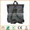 Unisex messenger bag and backpack. Wool-Polyester mix with green details and lining. Multiple pockets