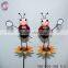 Iron garden stakes of metal beetle standing on kettle sticks for garden decoration