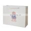 Wholesale Cheap Custom Design Classic Gift Clothing White Cardboard Shopping Paper Bag with Ribbon Handle