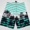 coconut tree print fabric ready-made board shorts for men taking a walk on the beach