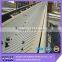 Low profile cleat molded on a 6 ich center line chevron conveyor belt