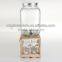 huge glass mason jar with tap with wooden stand