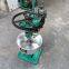 Machine for fine grinding round beads of colored gemstones