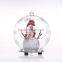 clear glass ball with snow man wear scarf inside