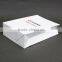 White paperboard bags with handles