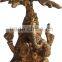 brass ganesha under tree