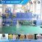 Automatic shrink wrapping machine