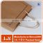 Wholesale elegant design kraft cutomize paper carrier bag