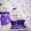 Sweet teddy bear plush toy with purple dress