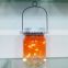 Beautiful orange glow led mason jar solar lights for wall or porch decor