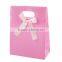 Fastener bow pink plastic bag gift design