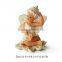 Polyresin smiling sitting angel figurine