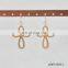 Worn goldworn silver knot earring