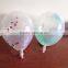 transparent latex balloon within foil confetti