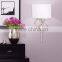 1017-1 sleek brushed steel finish raindrops falling on a calm body of water intertwining Circles Plug-In Wall Sconce