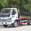 Hook arm garbage truck