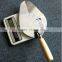 Professional construction tools brick with wood handle trowel
