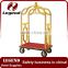 Used hotel luggage cart in bronze plated