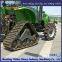 Tractor modification with triangular chain track assembly for strong off-road performance