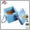 Blue folding corrugated paper box with handle for gift packing