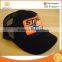 Curved brim Black Trucker Style Hat / Cap with Orange Patch