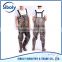 durable cheap waterproof pvc chest high fishing wader being used as aquacultural working wear