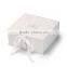 Glossy white collapsible cardboard boxes