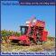 Corn harvester modified with triangular track wheels for anti slip in flooded areas