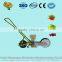 Manual hand push corn seeder