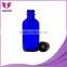 40z cobalt blue boston round glass bottles with phenolic screw cap