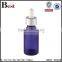 wholesale hot selling 30ml golden aluminum basket dropper essential oil perfume empty blue glass bottle dropper manufacturer