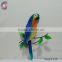 a parrot standing on branch animal wall hanging decoration