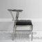 vintage industrial tubular metal frame chair with modern leather seat