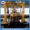 Hydraulic trailer mounted water well drilling rig