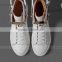 White leather men sneakers with button on the top